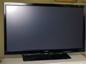 Before repair: Sony Bravia TV with dark areas and uneven backlighting
